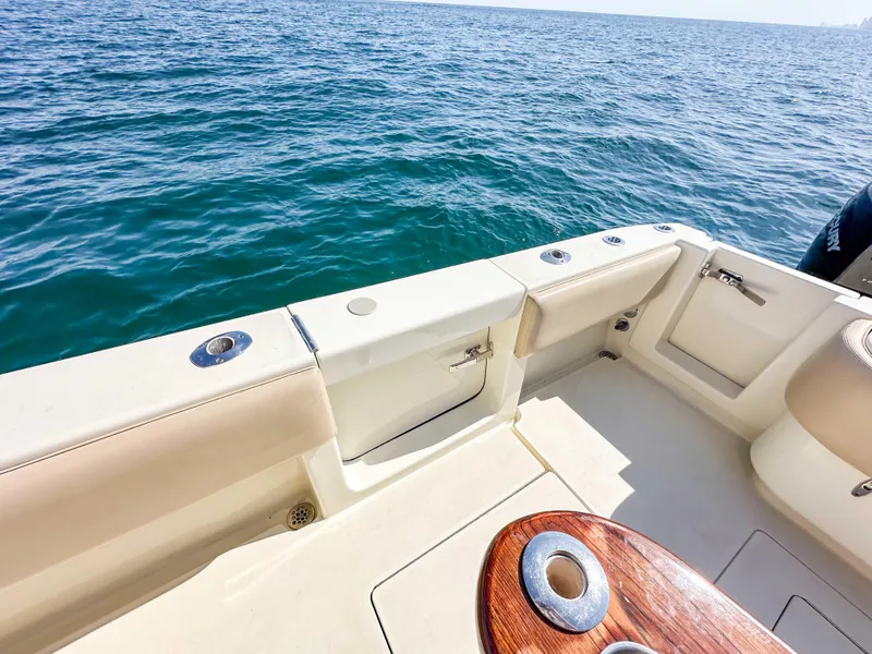 Slide: The Image of 2012 Contender 39 ST boat deck with ocean view, featuring sleek design and wood accents. - 25