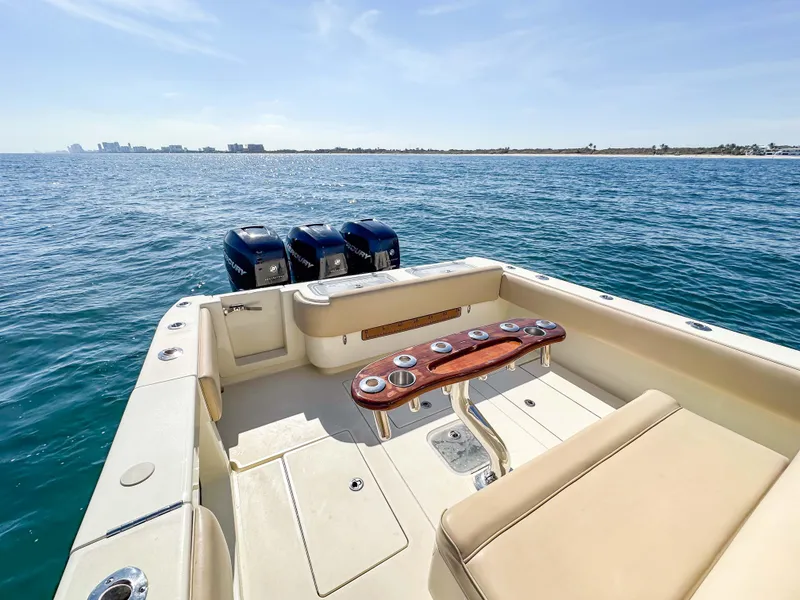 Slide: The Image of 2012 Contender 39 ST boat with triple engines on open water. - 28