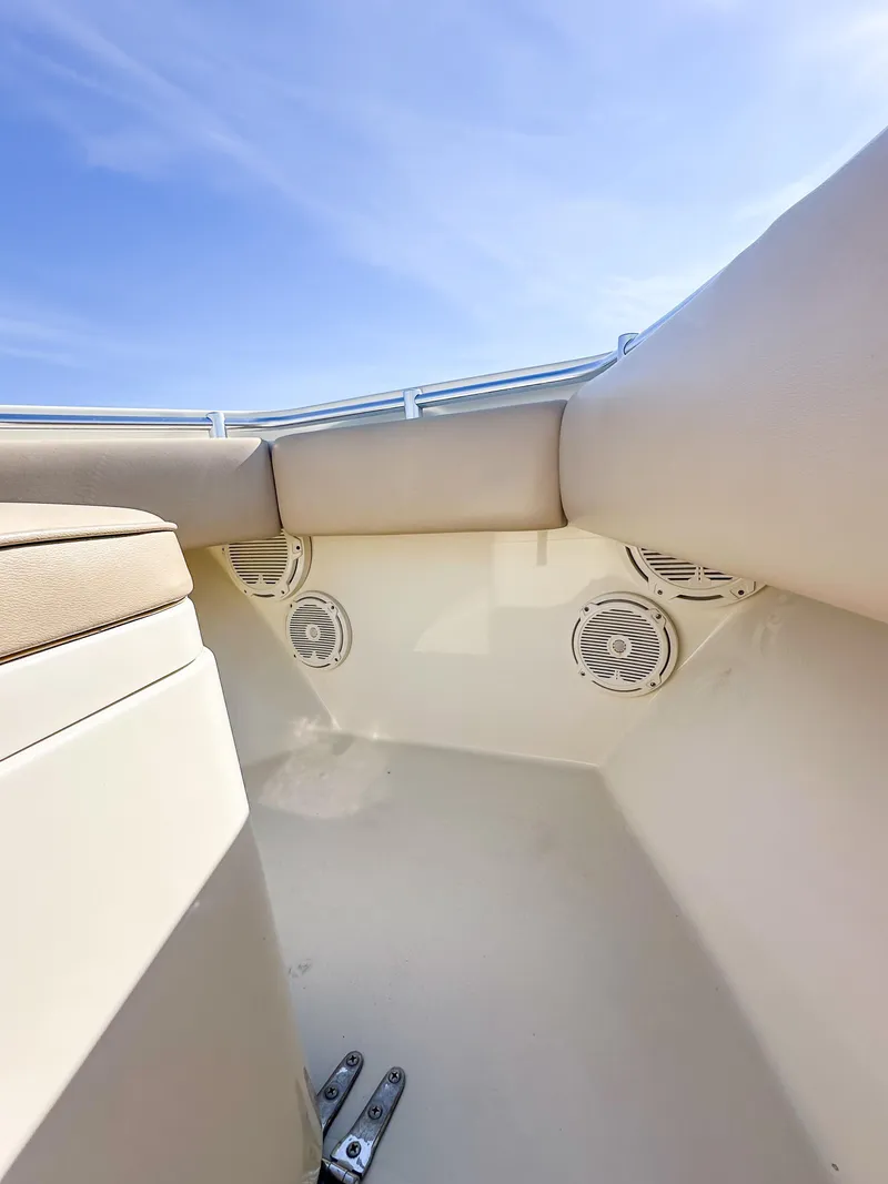 Slide: The Image of Interior view of a 2012 Contender 39 ST boat, featuring seating and speakers. - 30