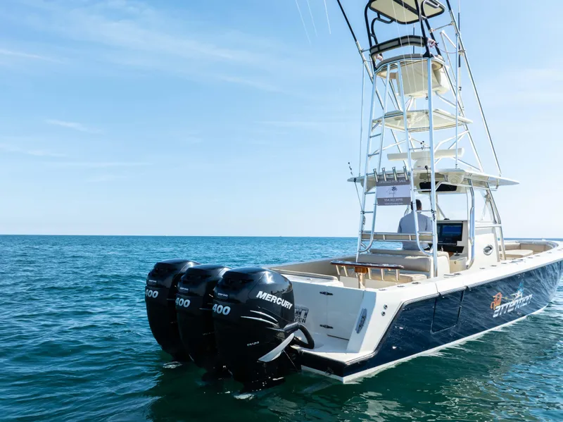 Slide: The Image of 2012 Contender 39 ST boat with triple Mercury engines on open sea. - 7