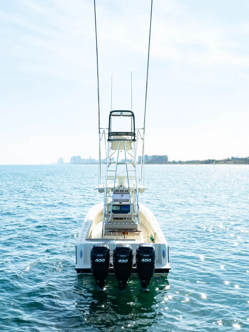 Slide: The Image of 2012 Contender 39 ST boat with triple 400 engines on open water. - 8