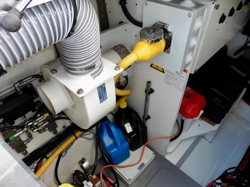 Slide: The Image of Engine room of 2017 Jeanneau Leader 46 with various mechanical components and wiring. - 10