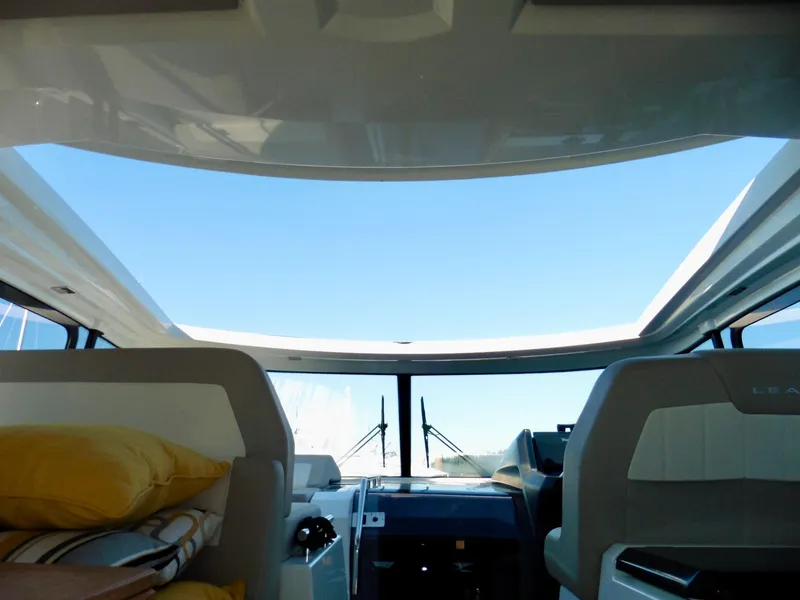 Slide: The Image of Interior view of 2017 Jeanneau Leader 46 yacht with open sunroof and seating. - 16