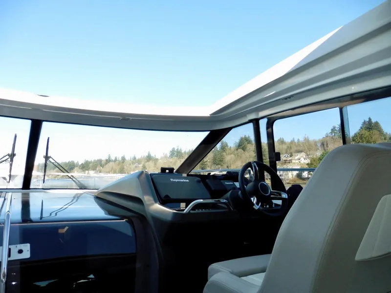 Slide: The Image of Interior view of 2017 Jeanneau Leader 46 yacht cockpit with steering wheel. - 17