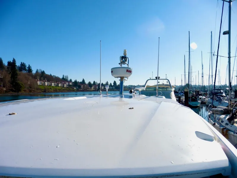 Slide: The Image of 2017 Jeanneau Leader 46 yacht docked in a marina under clear blue skies. - 18