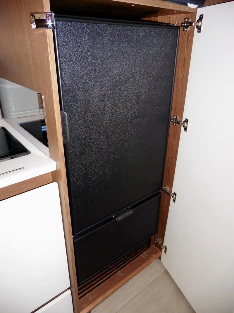 Slide: The Image of Built-in refrigerator in 2017 Jeanneau Leader 46 yacht kitchen cabinet. - 45
