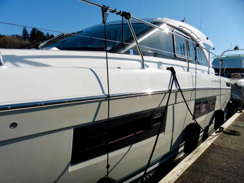 Slide: The Image of 2017 Jeanneau Leader 46 yacht docked, showcasing sleek design and modern features. - 5