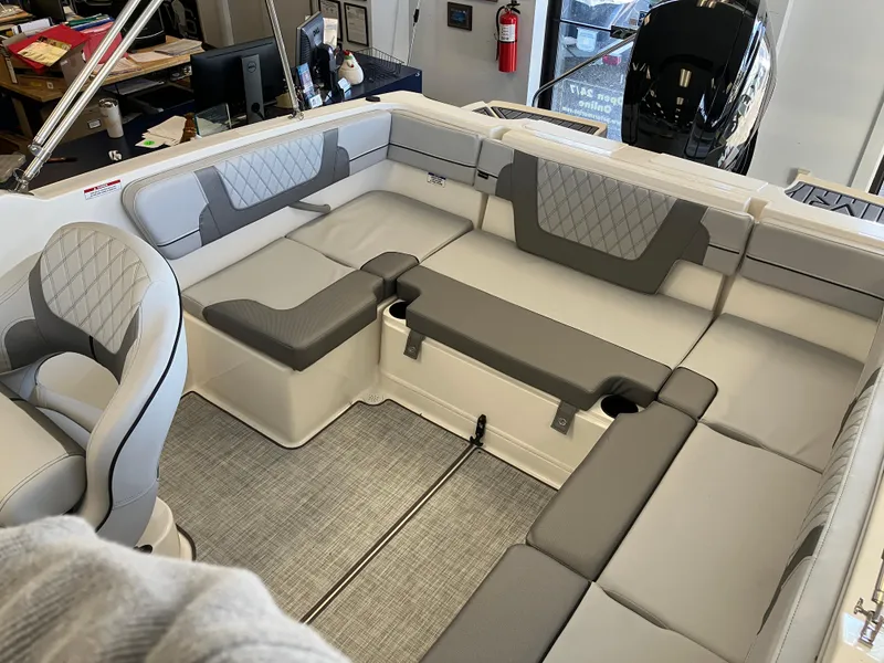 Slide: The Image of 2024 Bayliner VR4 Bowrider OB interior with gray seating and modern design. - 5