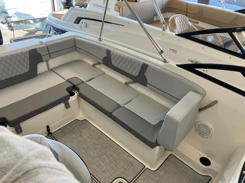 Slide: The Image of 2024 Bayliner VR4 Bowrider OB interior with gray seating and modern design. - 7