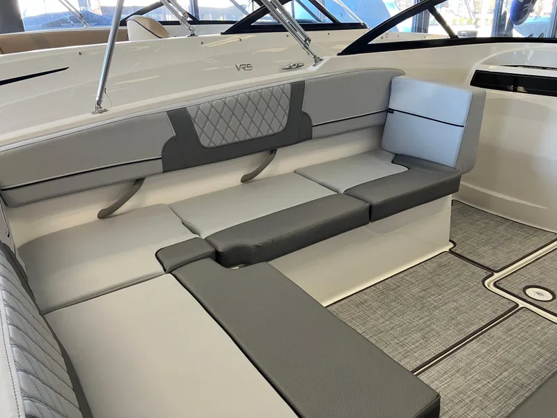 Slide: The Image of 2024 Bayliner VR4 Bowrider OB interior with gray cushioned seating and modern design. - 8