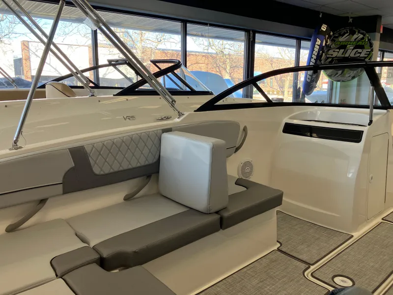 Slide: The Image of 2024 Bayliner VR4 Bowrider OB interior with gray seating and modern design. - 9