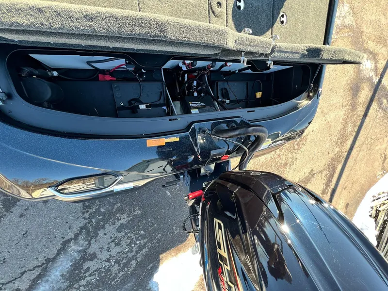 Slide: The Image of 2025 Skeeter ZXR 20 SE boat with open engine compartment, showcasing internal components. - 19