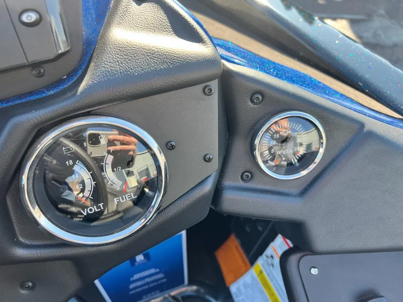 Slide: The Image of Dashboard gauges of 2025 Skeeter ZXR 20 SE boat, showing volt, fuel, and water pressure. - 2