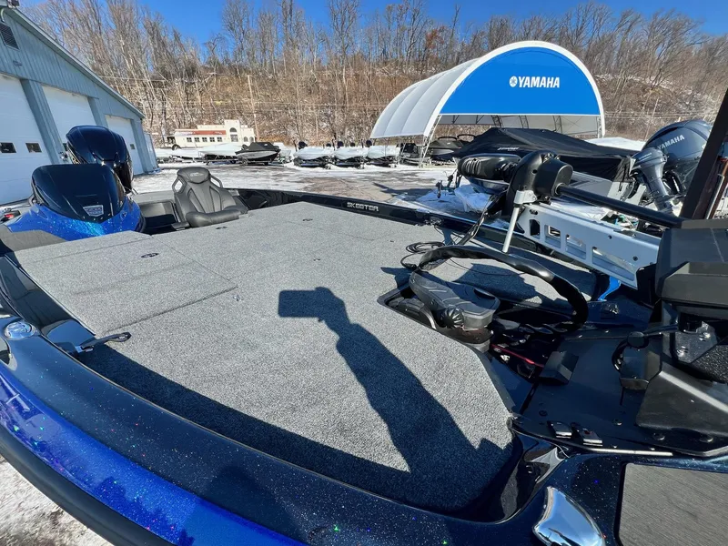 Slide: The Image of 2025 Skeeter ZXR 20 SE boat with Yamaha equipment, parked outdoors in a snowy setting. - 20