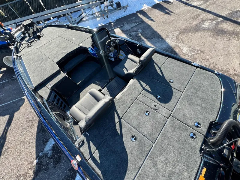 Slide: The Image of 2025 Skeeter ZXR 20 SE boat interior with gray seating and carpeted deck. - 22