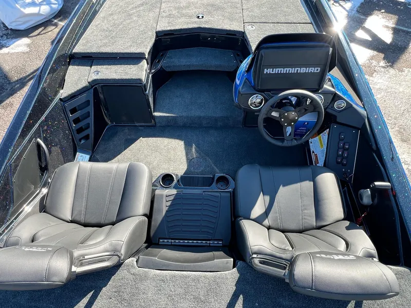 Slide: The Image of 2025 Skeeter ZXR 20 SE boat interior with dual seats and Humminbird dashboard. - 23