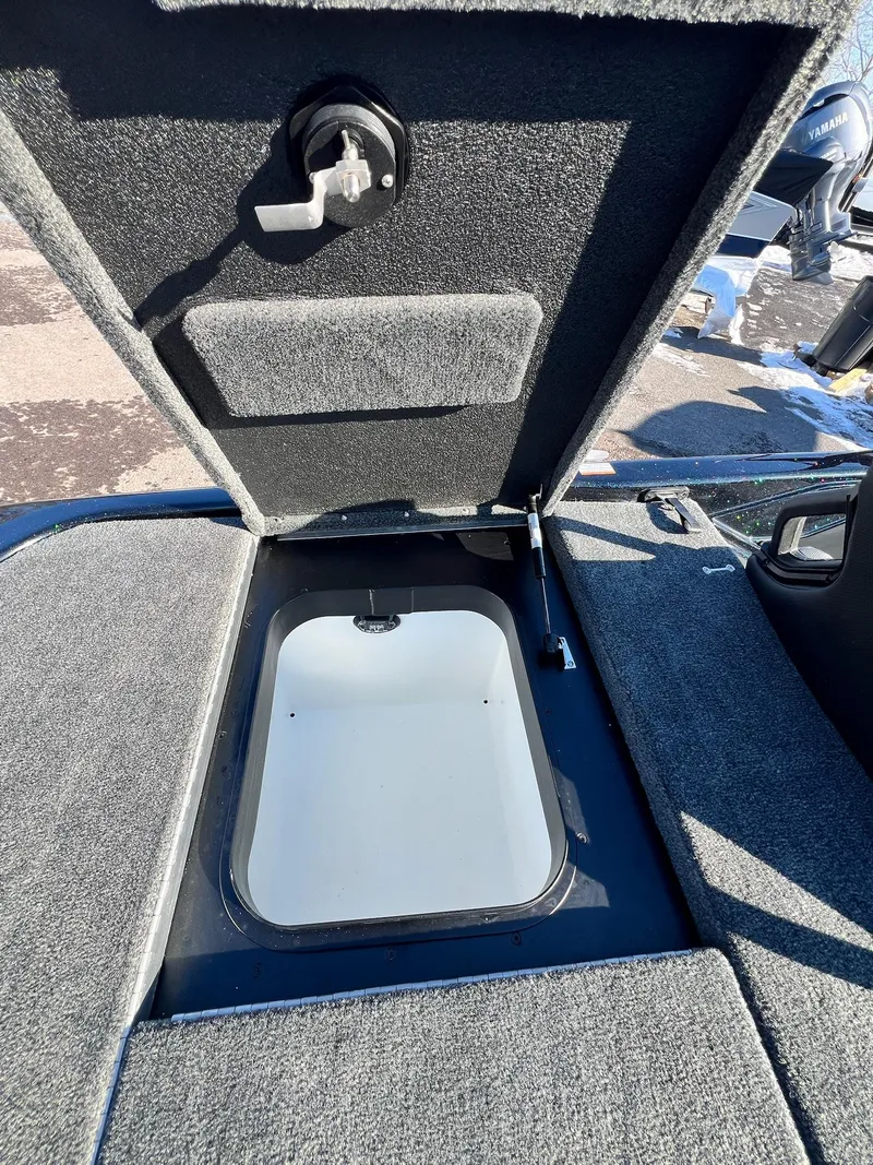 Slide: The Image of Open storage compartment in 2025 Skeeter ZXR 20 SE boat. - 26