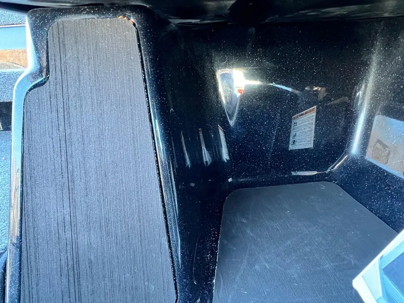 Slide: The Image of Interior view of 2025 Skeeter ZXR 20 SE boat compartment, featuring textured surfaces. - 27