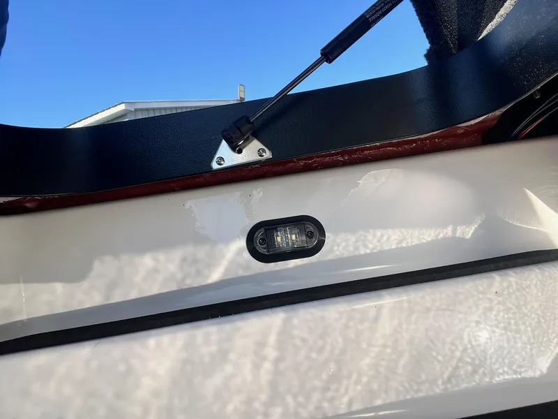 Slide: The Image of 2025 Skeeter ZXR 20 SE boat compartment with hydraulic lift and interior light. - 30