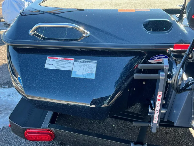 Slide: The Image of 2025 Skeeter ZXR 20 SE boat rear view with ladder and safety instructions. - 33