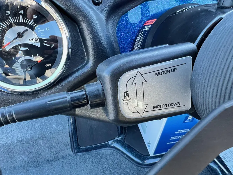 Slide: The Image of Close-up of 2025 Skeeter ZXR 20 SE boat controls and RPM gauge. - 38