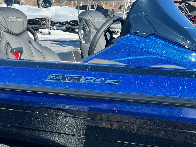 Slide: The Image of 2025 Skeeter ZXR 20 SE boat with sparkling blue finish and sleek design. - 4