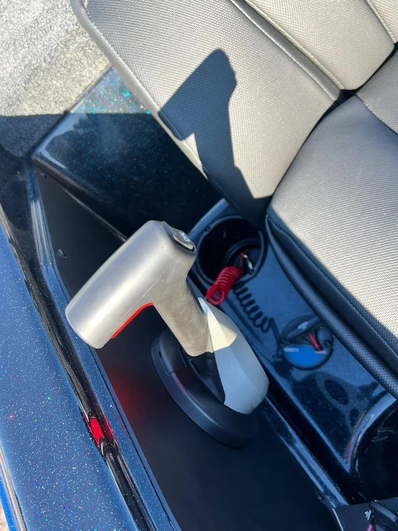 Slide: The Image of 2025 Skeeter ZXR 20 SE boat interior with throttle control and seat detail. - 6