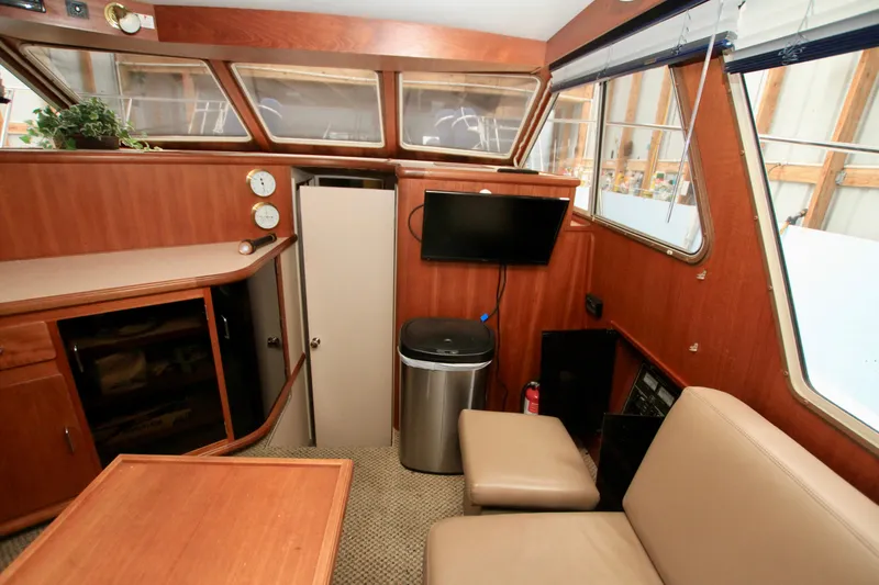 Slide: The Image of Interior of 1989 Tollycraft 34 Sport Sedan with wood paneling and seating. - 27