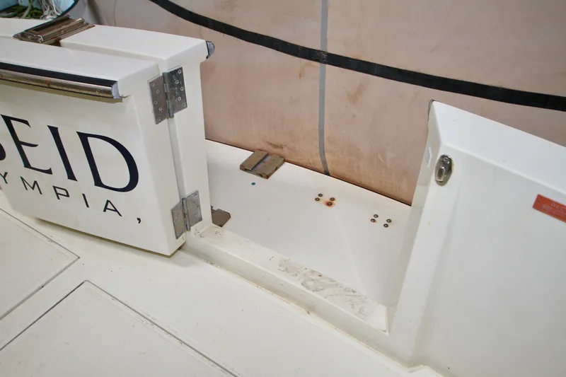 Slide: The Image of 1989 Tollycraft 34 Sport Sedan boat deck with storage compartment. - 45