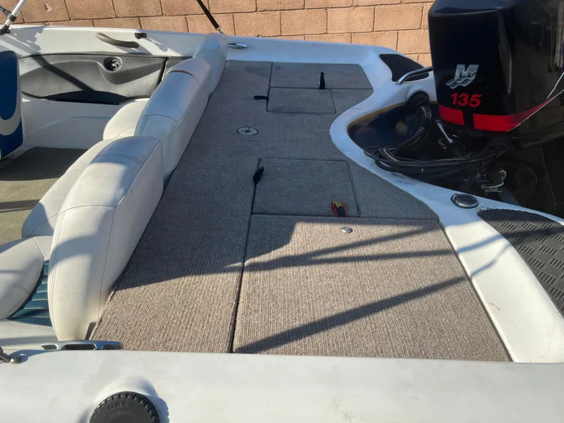 Slide: The Image of 2002 Nitro 188 Sport boat interior with seating and 135 HP motor. - 10