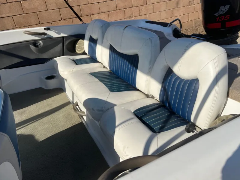 Slide: The Image of 2002 Nitro 188 Sport boat interior with white and blue seating. - 11