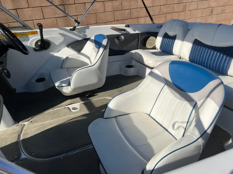 Slide: The Image of 2002 Nitro 188 Sport boat interior with white and blue seating. - 13