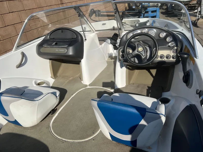 Slide: The Image of 2002 Nitro 188 Sport boat interior with steering wheel and seating. - 5