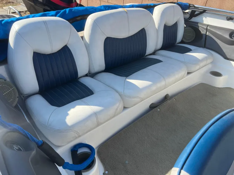 Slide: The Image of 2002 Nitro 188 Sport boat interior with blue and white cushioned seating. - 7