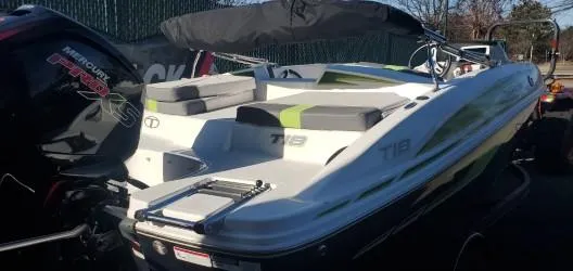Slide: The Image of 2024 Tahoe T18 boat with Mercury Pro XS engine, docked outdoors. - 5