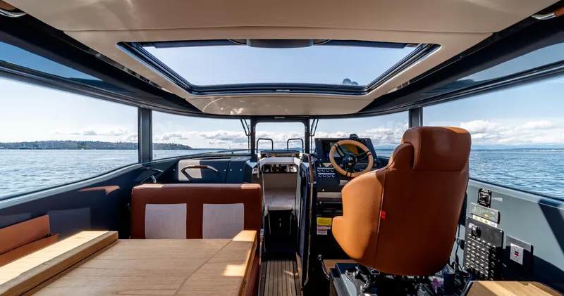 Slide: The Image of Interior view of 2023 Arksen 30 boat, featuring modern design and panoramic windows. - 33