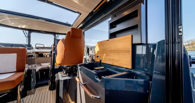 Slide: The Image of Interior of 2023 Arksen 30 boat featuring modern seating and sleek kitchen area. - 40