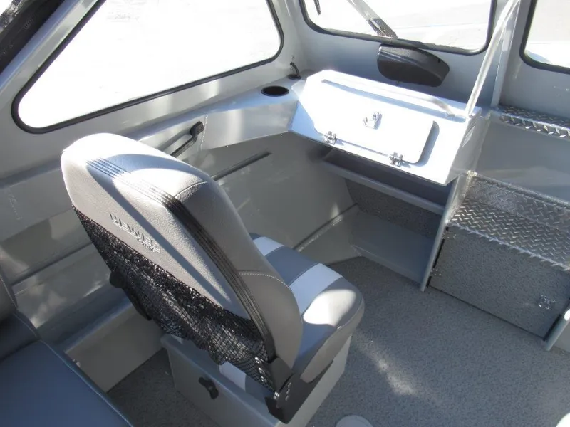 Slide: The Image of Interior of 2025 Hewescraft 200 PRO V ET boat, featuring seating and storage compartments. - 13