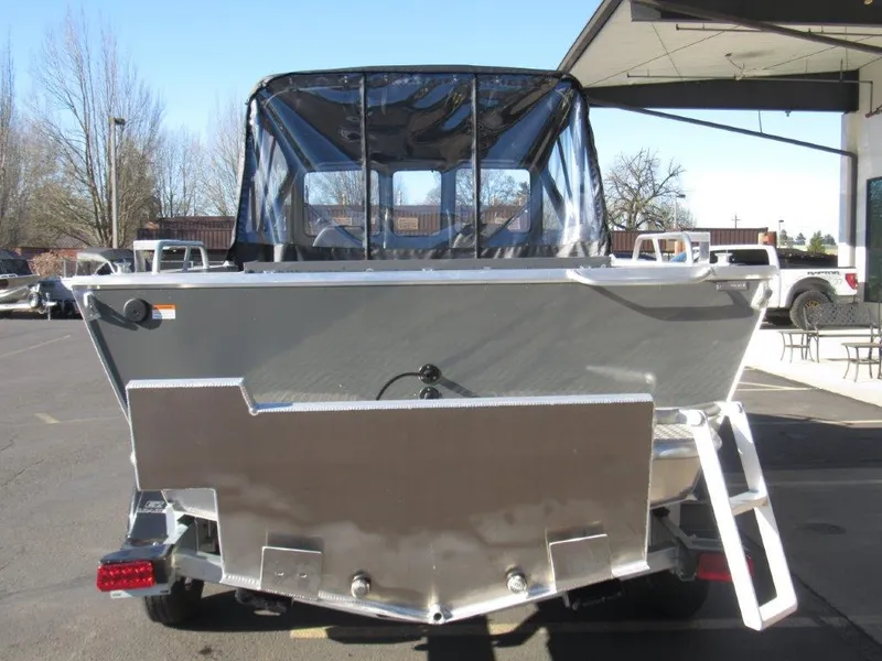 Slide: The Image of 2025 Hewescraft 200 PRO V ET boat, rear view, parked outdoors. - 4
