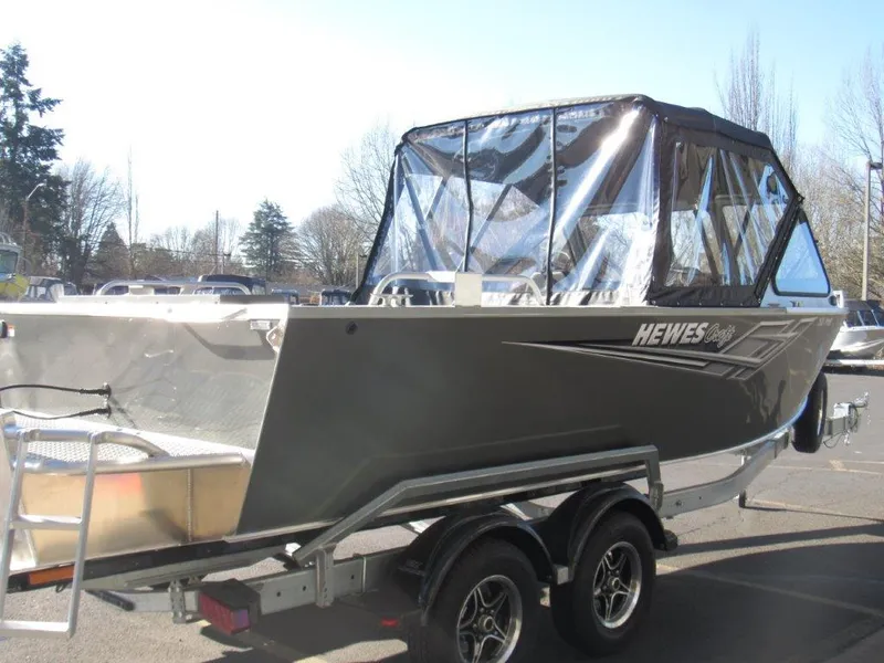 Slide: The Image of 2025 Hewescraft 200 PRO V ET boat on trailer, featuring a sleek design and protective canopy. - 5