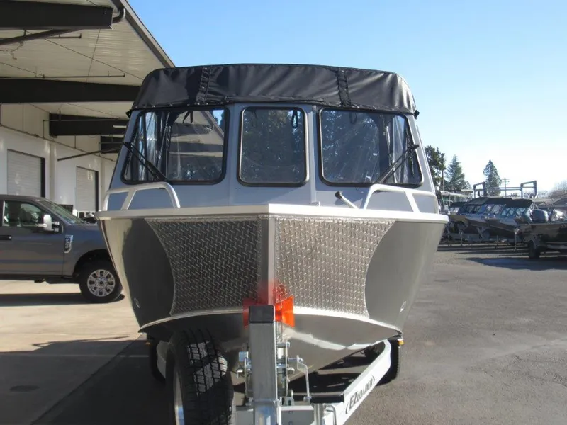 Slide: The Image of 2025 Hewescraft 200 PRO V ET boat on trailer, parked outdoors. - 8