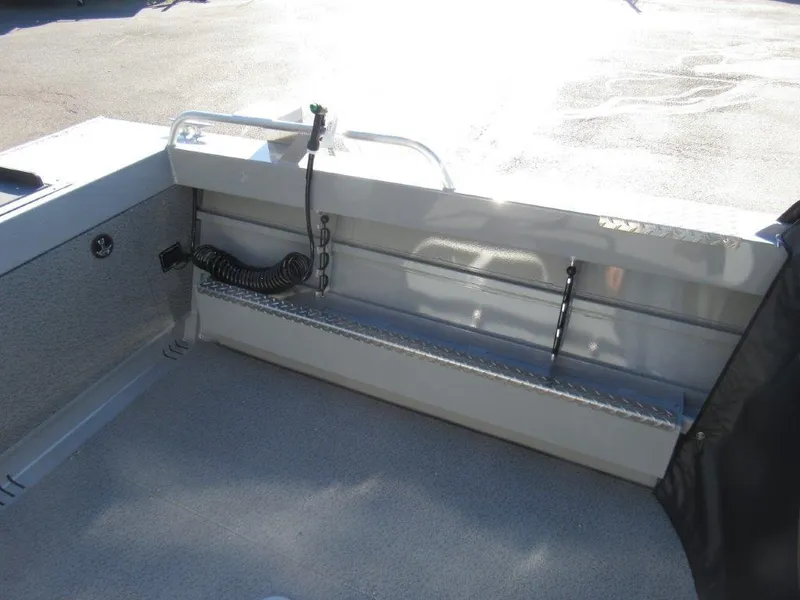 Slide: The Image of 2025 Hewescraft 200 PRO V ET boat interior, featuring a clean, spacious deck area. - 9