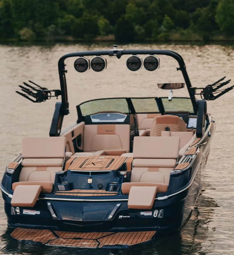 Slide: The Image of 2025 MasterCraft X24 boat on water, featuring luxurious seating and sleek design. - 3