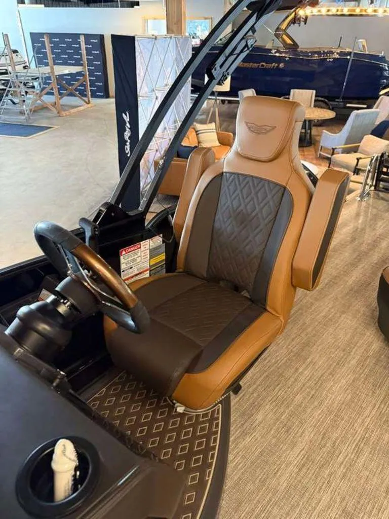 Slide: The Image of Luxurious captain's chair in 2025 Bennington M Swingback 24 MSB boat interior. - 2