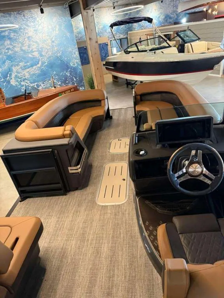 Slide: The Image of Interior of 2025 Bennington M Swingback 24 MSB pontoon boat in showroom. - 3