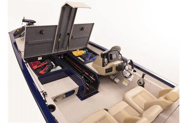 Slide: The Image of 2023 G3 Sportsman 1710 boat interior with storage compartments and steering console. - 4