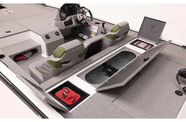 Slide: The Image of 2023 G3 Sportsman 1710 boat interior with seating, storage compartments, and steering console. - 8