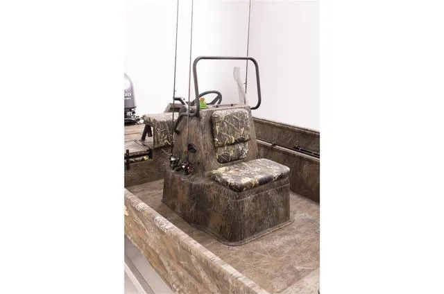 Slide: The Image of 2023 G3 18 CC boat with camouflage seating and steering console. - 4