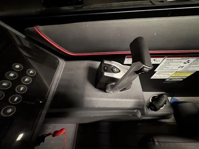 Slide: The Image of 2023 Manitou Explore 22 Max Bench control panel with joystick and buttons. - 12
