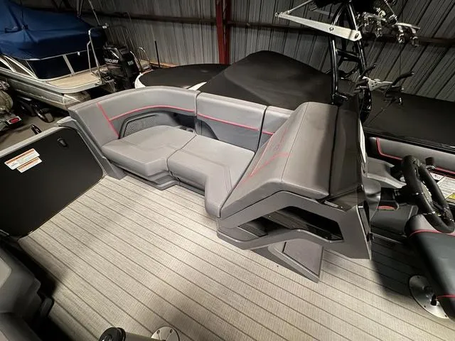 Slide: The Image of 2023 Manitou Explore 22 Max Bench interior with gray seating and modern design. - 19